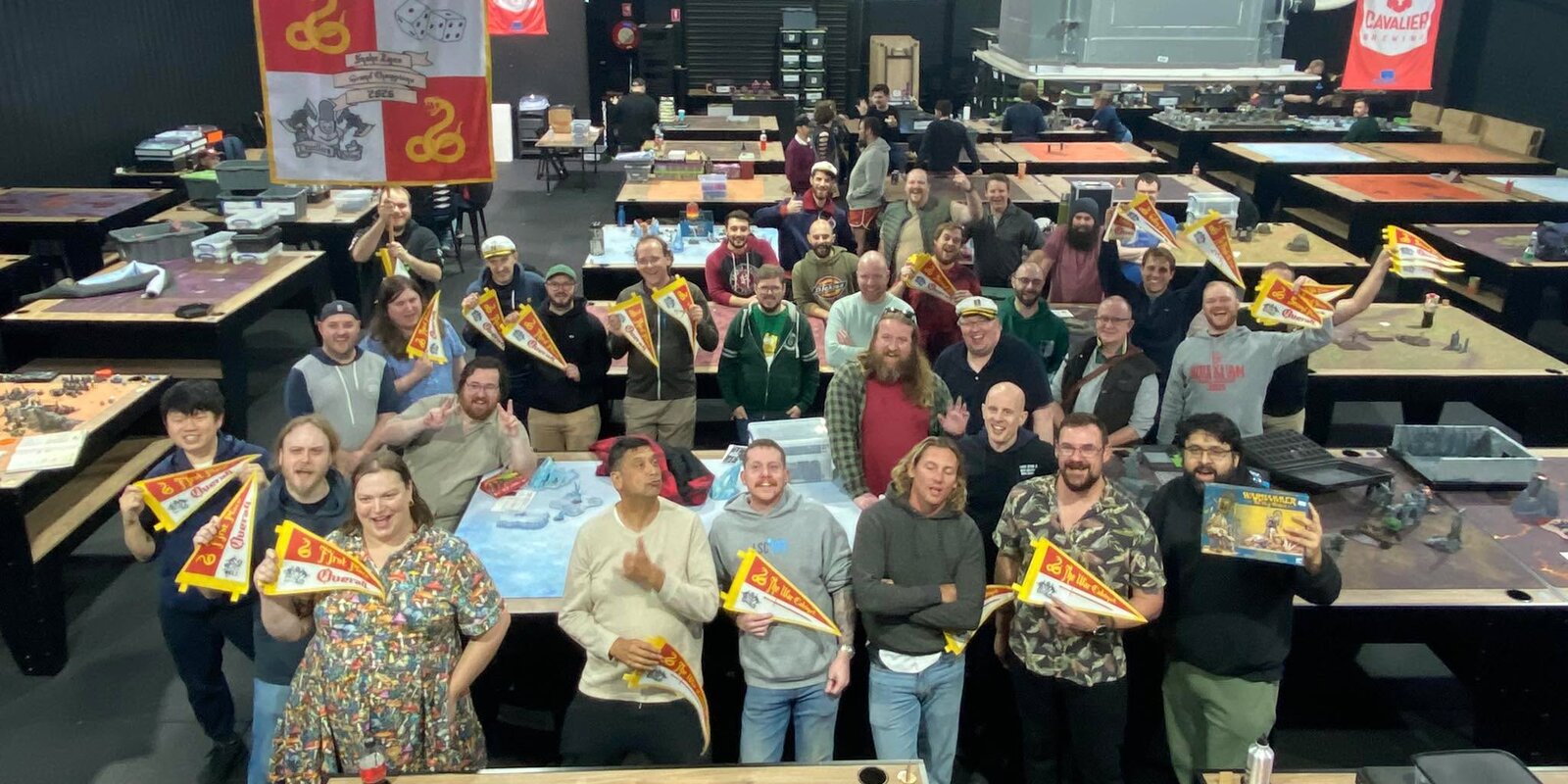 Players holding pennants at SNAKE EYES: More Mulchy More Cakey